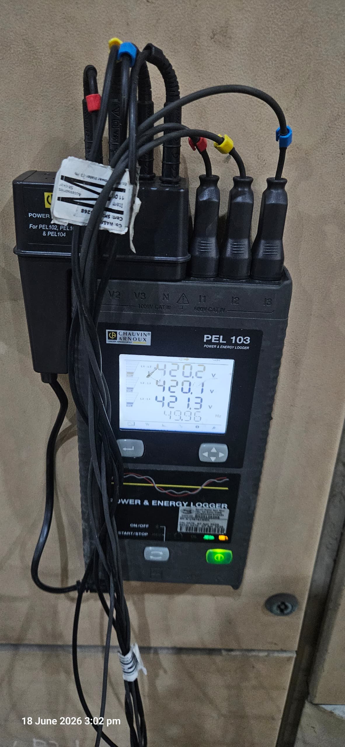 PEL 103 power and energy logger installed at a distribution board, recording three-phase demand during an energy audit